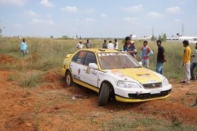 People near the colorful rally car