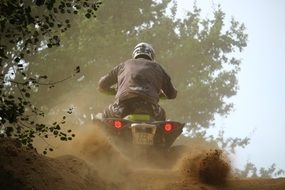 motocross competitions on a ATV in the dust