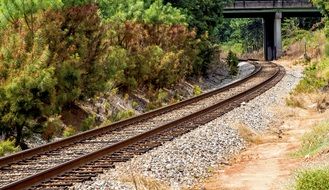 railway track on gravel among nature