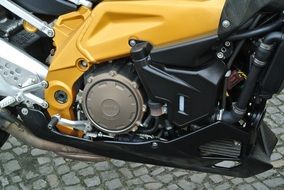 engine of a yellow motorcycle close-up