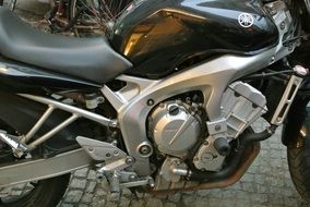 engine of a black motorcycle close-up