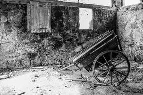 burnt house and wooden cart