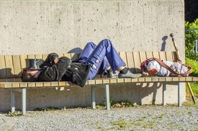 street artist sleeping on a bench