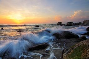 waves beating on stones