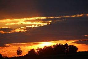 bright setting sun in the evening sky