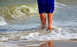 barefoot boy on the beach