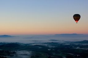 balloon at night over the mountains
