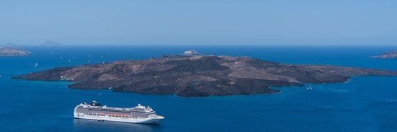 cruise liner near the island Santorini