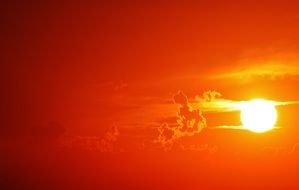 bright orange sun in the evening sky