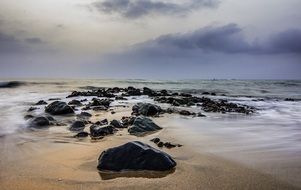 Seascape with the rocks on the beach