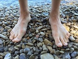 bare feet by the lake