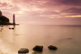 landscape of Lighthouse on a coast at the gorgeous Sunset
