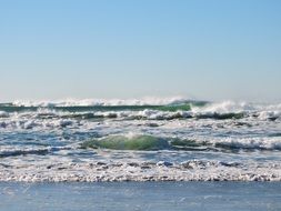 foamy Ocean Waves at blue beach