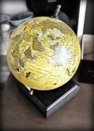 globe on a wooden stand