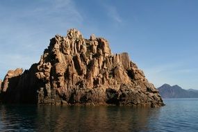 large rock in the water