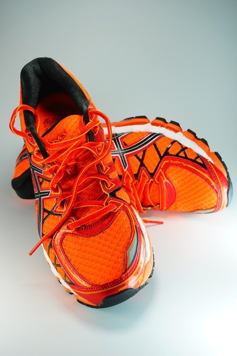 neon orange sneakers on white background