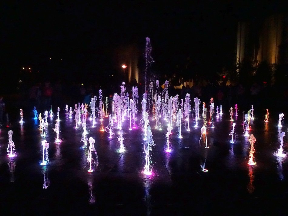 dancing luminous fountains in the dark