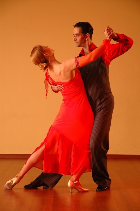 elegant couple is dancing in the gym