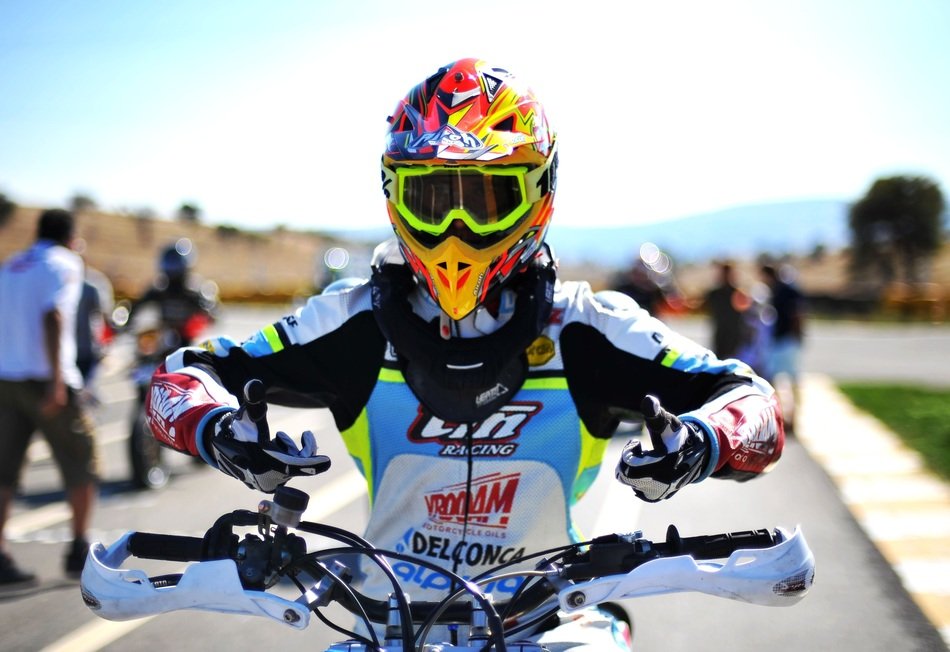 racer of a motocross under the bright sun