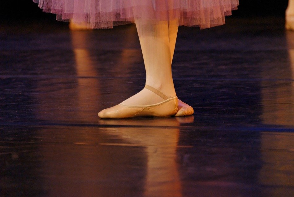 dancer's legs in classical ballet