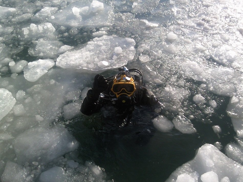 swimming diver in ice