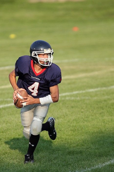 Quarterback, Football Passer runs on pitch