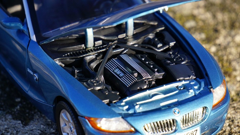 blue BMW as a model on the pavement