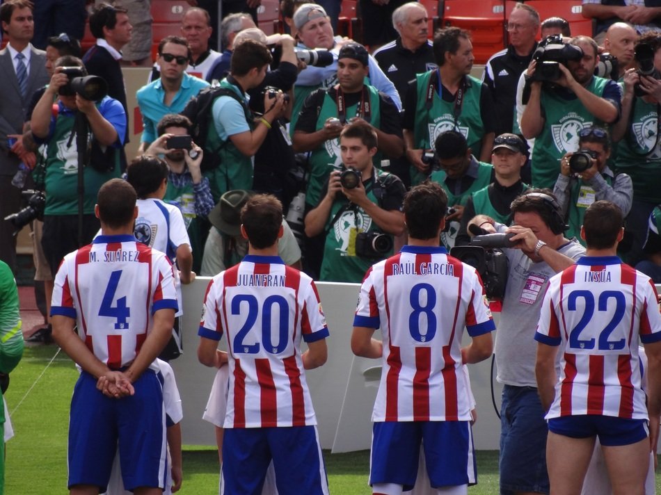 Football team in front of photographers