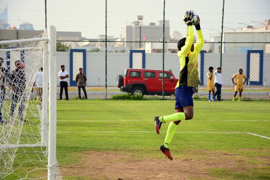 goalkeeper catches the ball