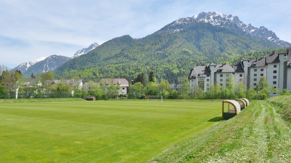 football field at the foot of the mountain