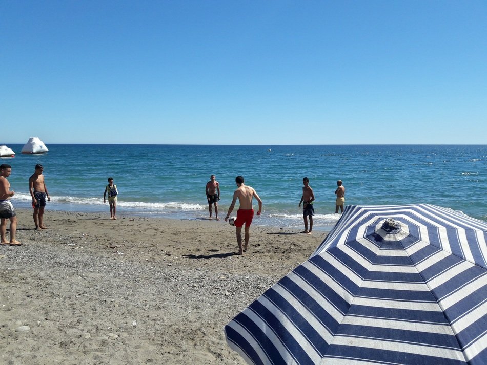 Football Match on beach at sea