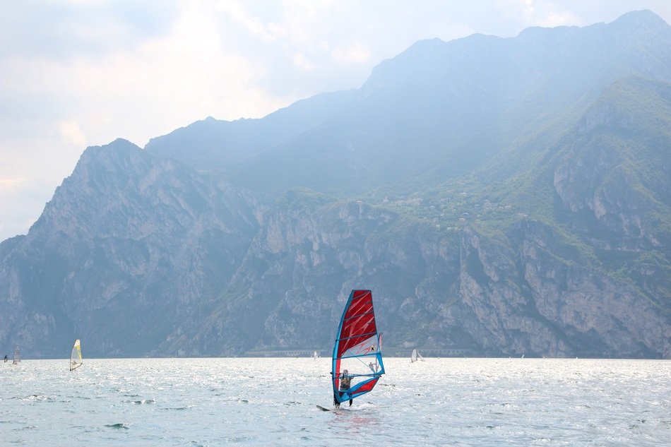 surfing on garda lake on a cloudy day