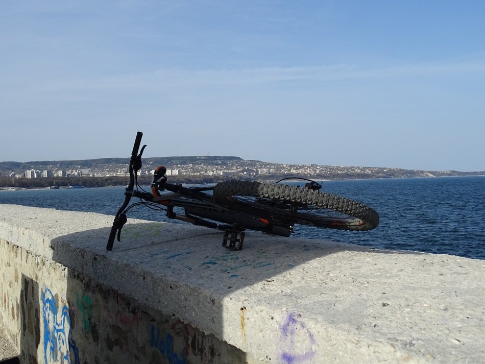 bike on a concrete parapet on the promenade