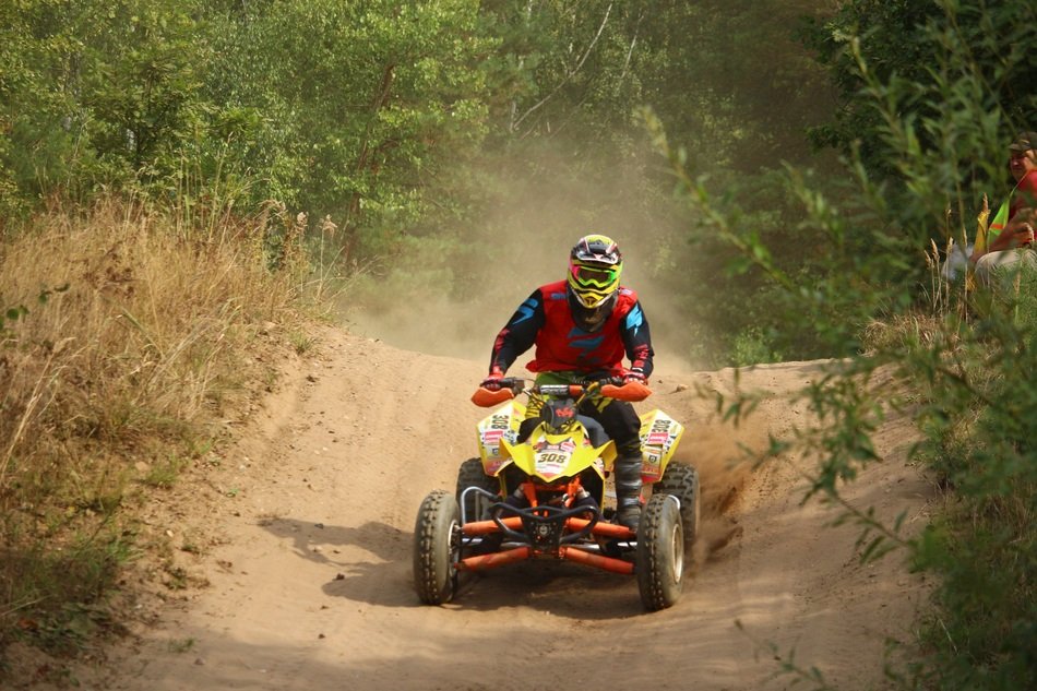 Quad cross on a sand