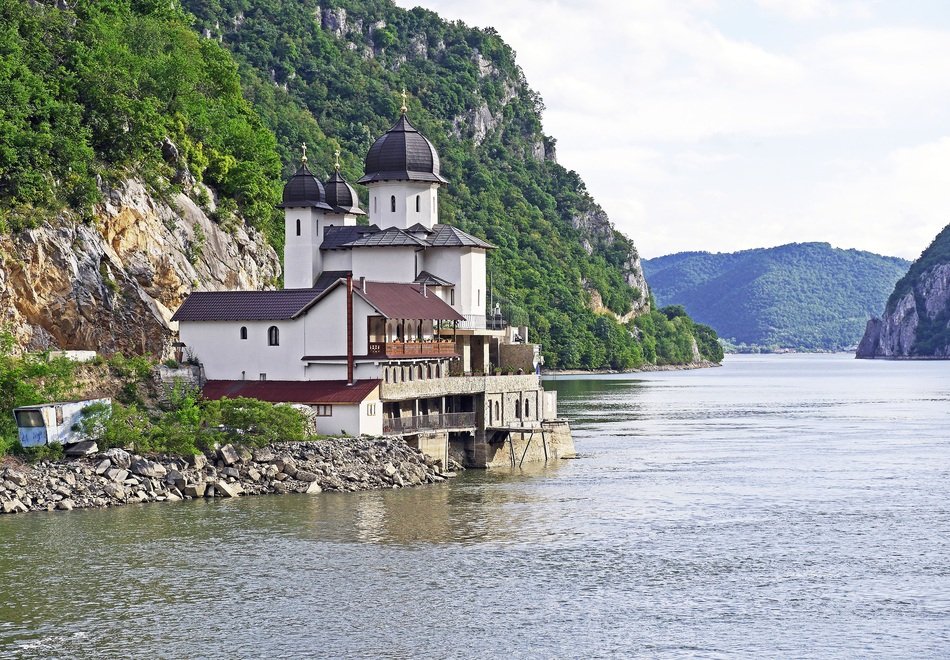 house near the river in the Danube Gorge