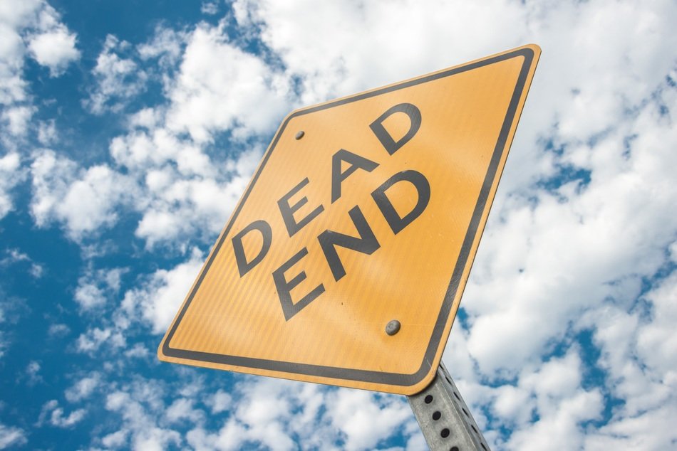 road sign on a background of white clouds