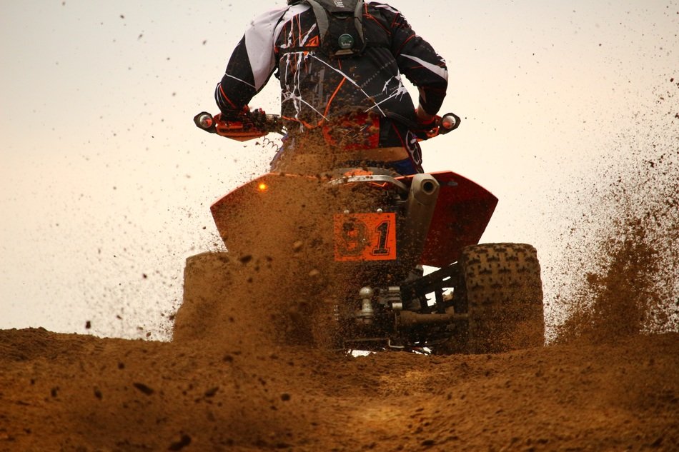 ATV rider with number '81'
