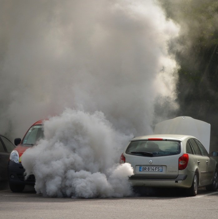 photo of two cars in big smoke
