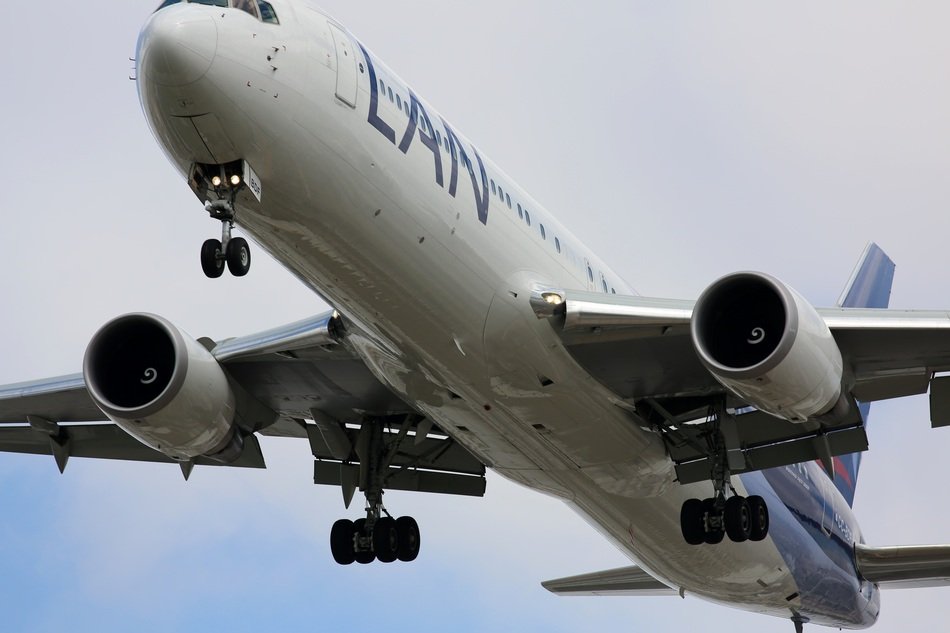 white plane in the sky close up