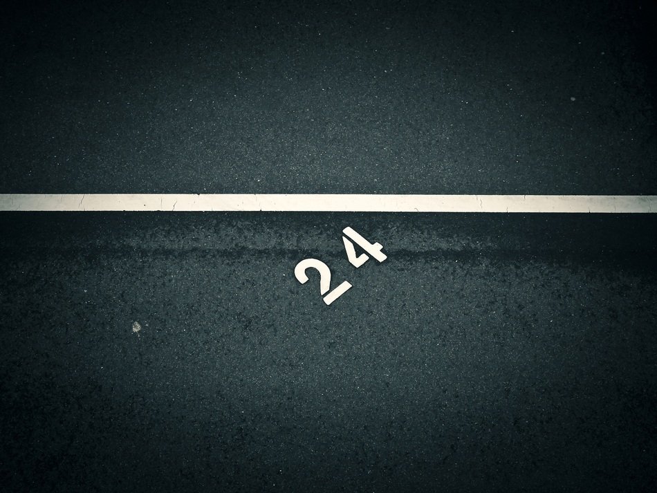 White '24' marking on the road