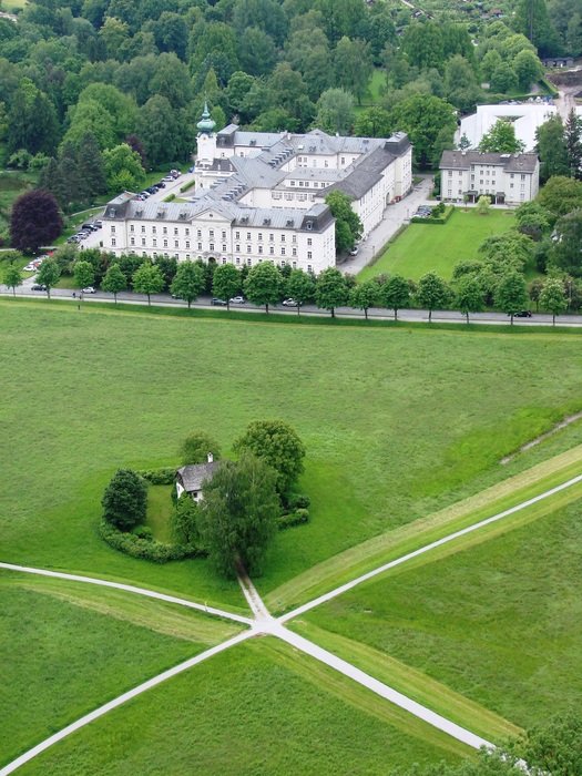 fork in the path on green lawn at castle