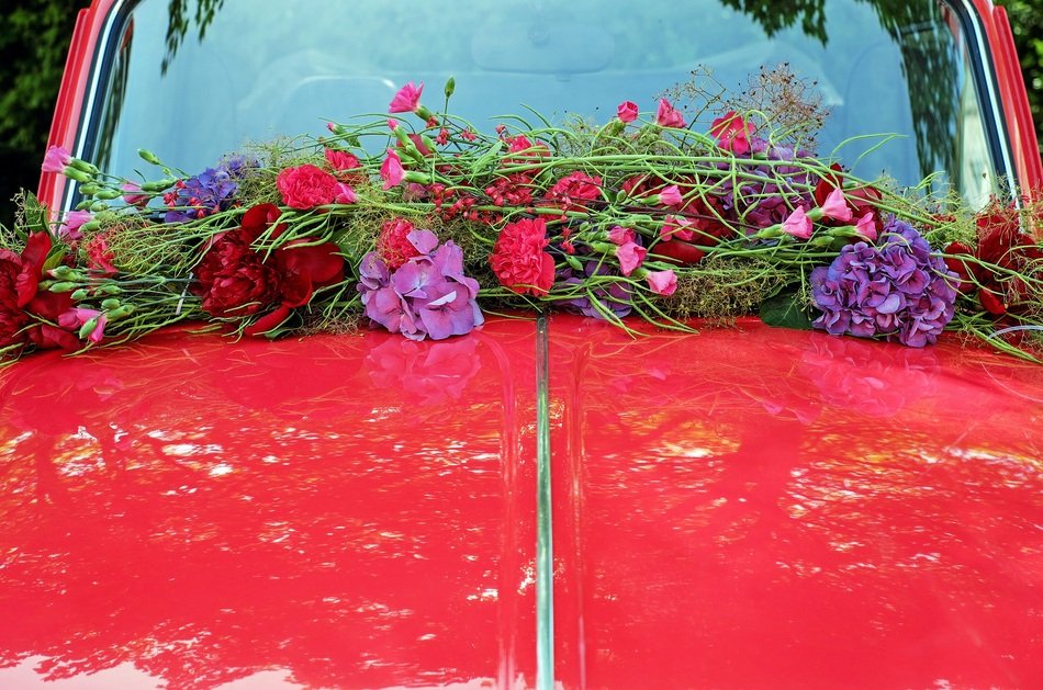 colorful flowers as a decoration of a wedding car