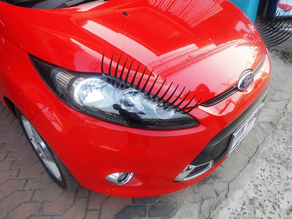front of the red car