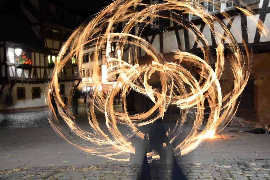 fire circles on the street in the background of the house