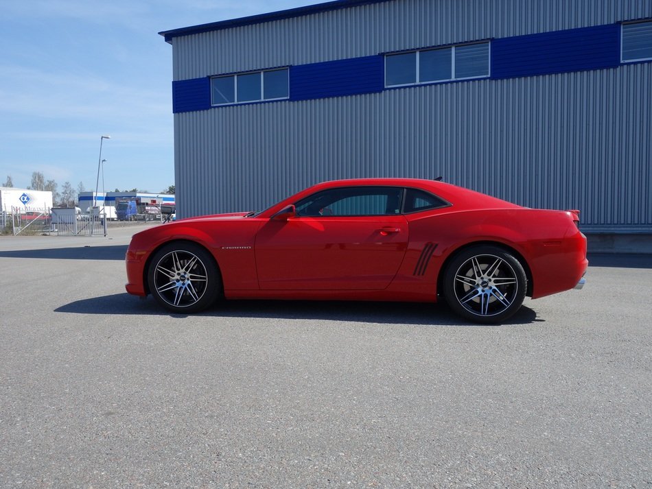 Beautiful red car with the aluminium wheels in Sweden