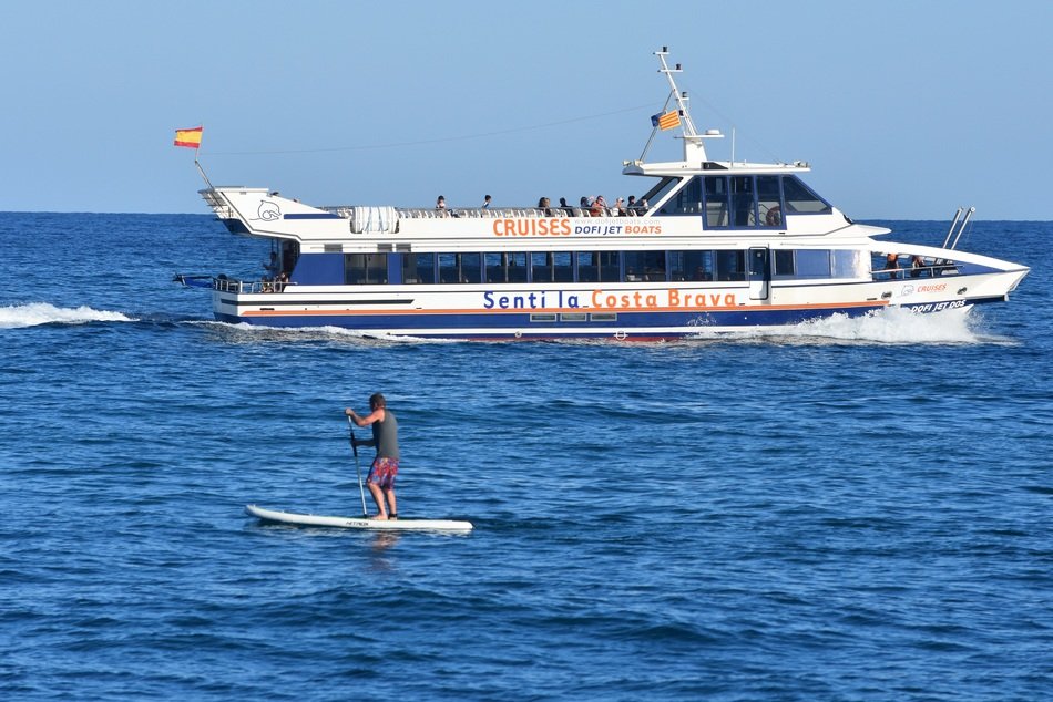 surfer on the background of a cruise ship