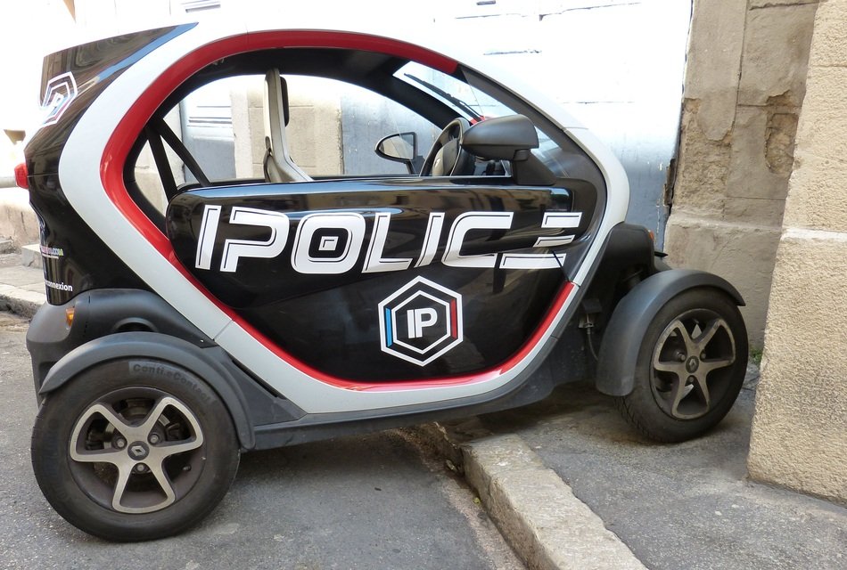 Police smart Car parked at wall