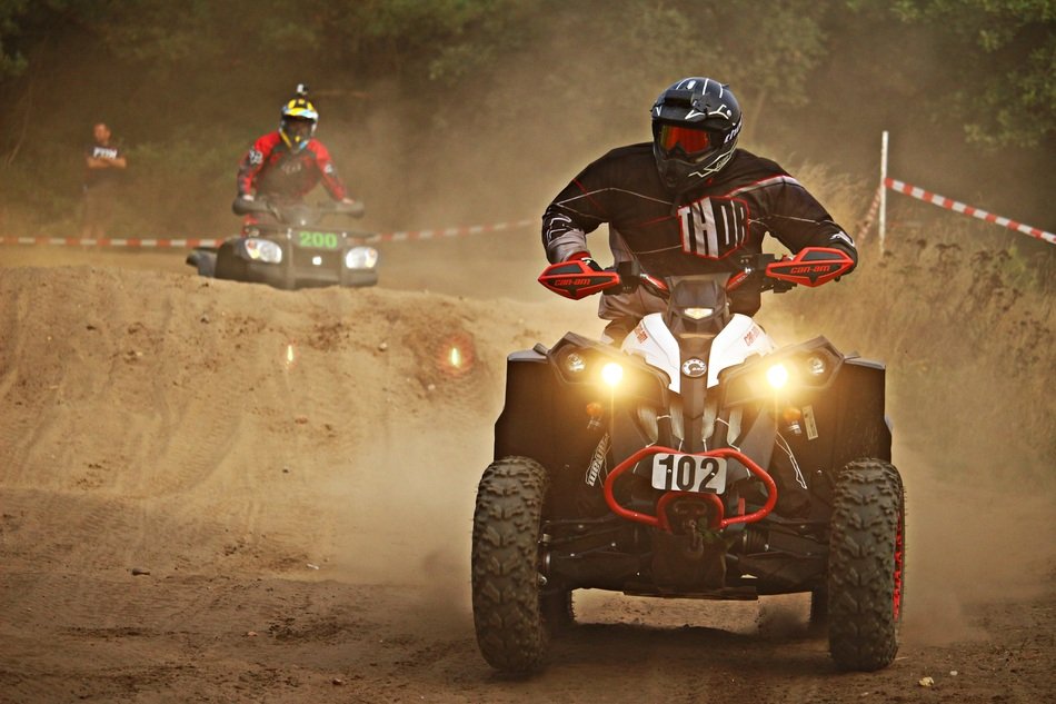 many ATV riders in the dust