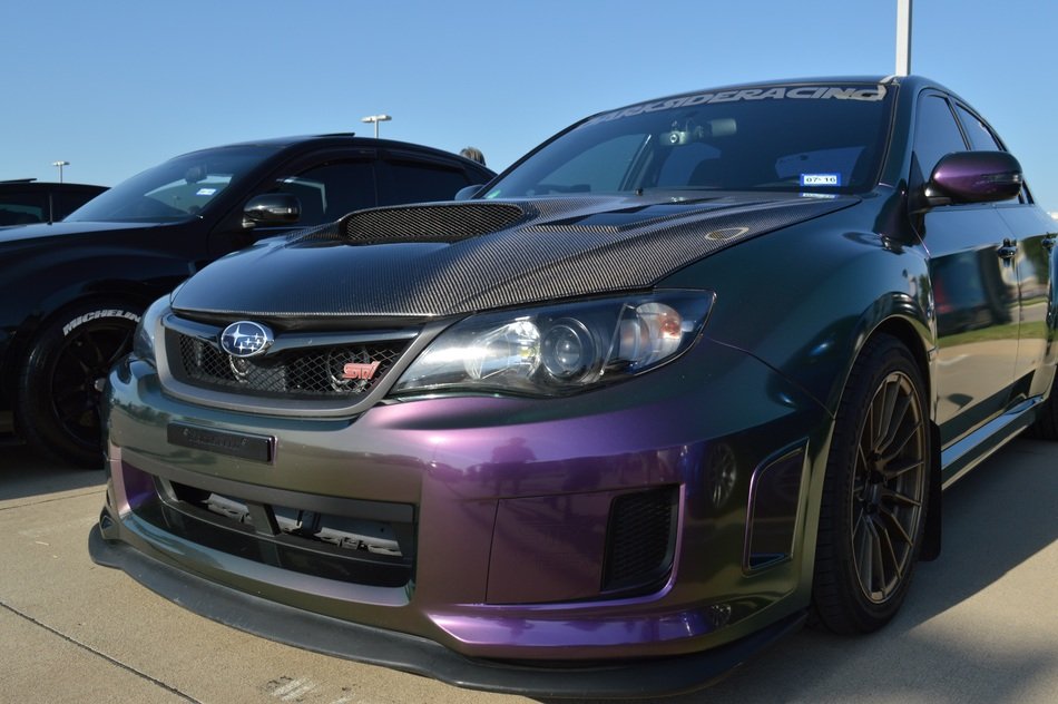 multicolor subaru wrx sti parked