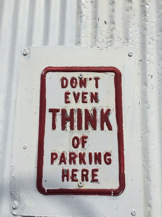 Parking sign on the wall
